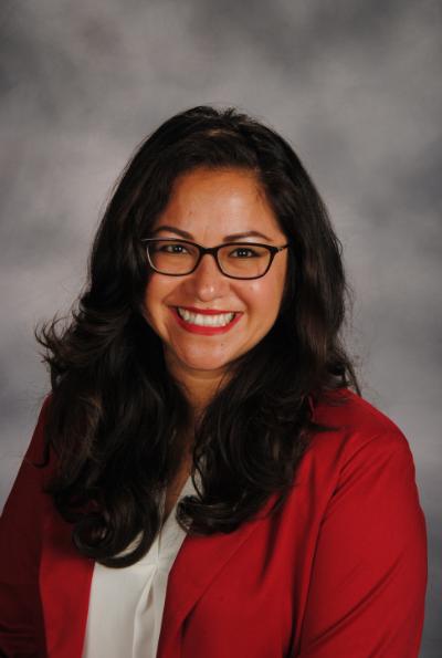 Headshot of Dr. Guevara, her hair is black and she is wearing glasses